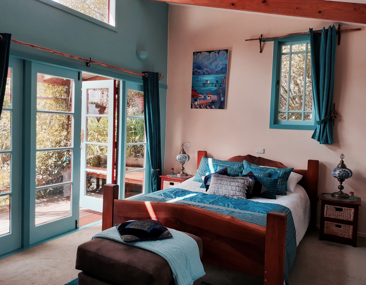 Photo of property: Queen size bed with french doors to private veranda.