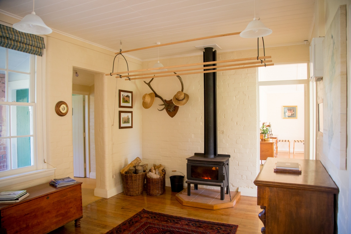 Photo of property: Cozy sitting room with wood burner