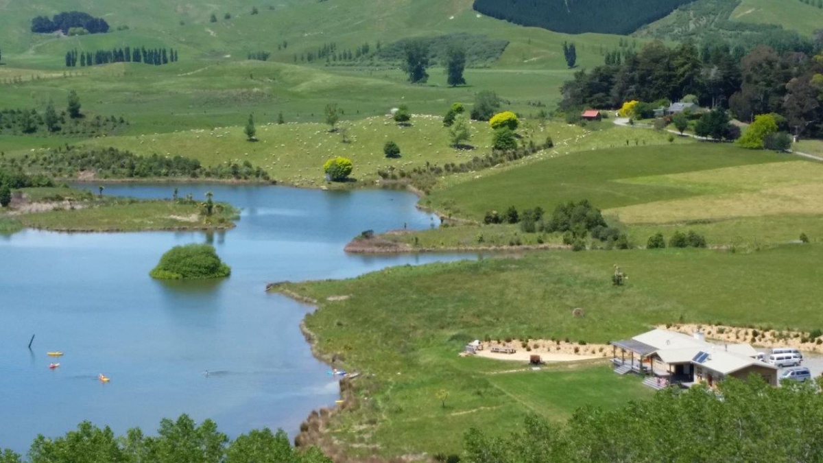 Photo of property: Lodge, lake and surrounding farm