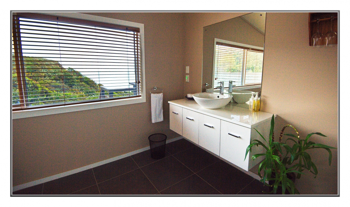 Photo of property: Breakwater bathroom - loo with a view to Tasman Sea
