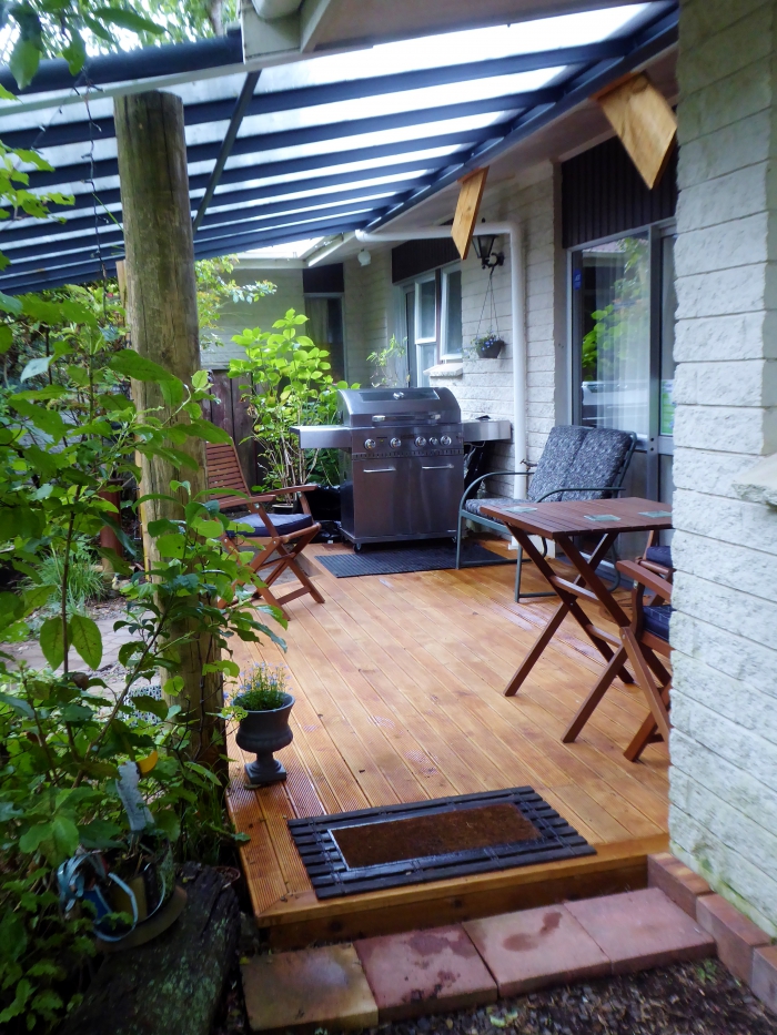 Photo of property: Shared covered patio with BBQ for guest use