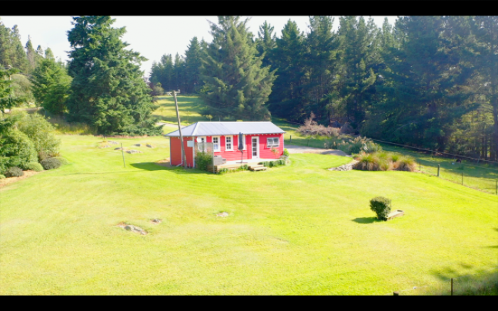 Photo of property: The lawn and surrounding garden and private space for guests to enjoy