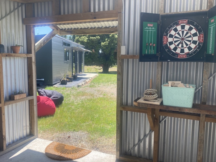 Photo of property: Shed with dart board & outdoor games.