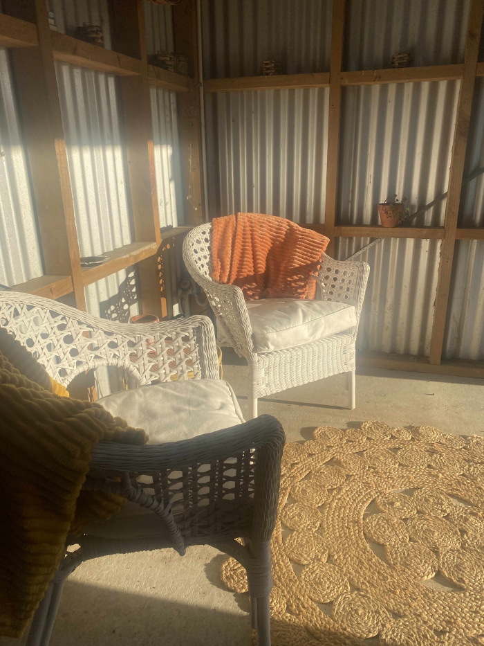 Photo of property: Sunny spot in the shed for your morning coffee.