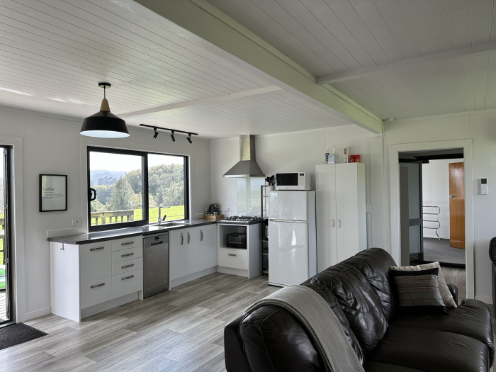 Photo of property: Kitchen & Lounge Area