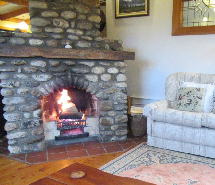 Photo of property: Open fire in lounge area