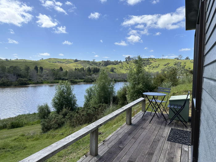 Photo of property: The deck with table and chairs