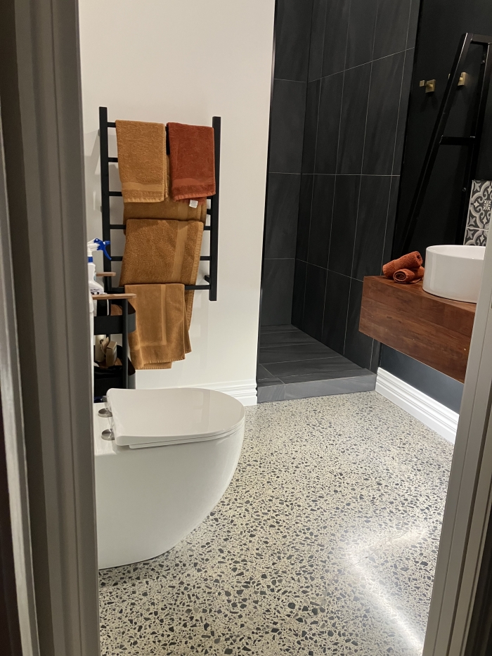 Photo of property: Bathroom: toilet, heated towel rail, vanity and walk in shower