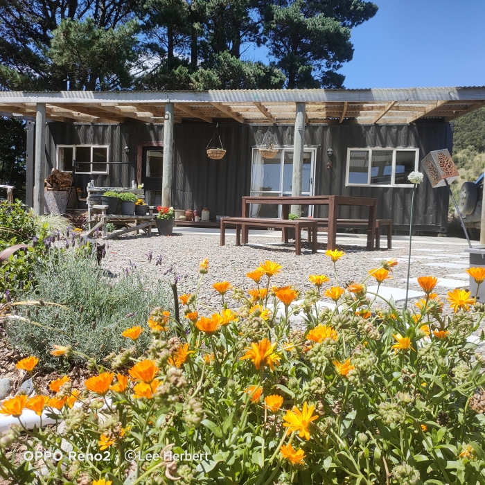 Photo of property: Lovely outdoor area to sit, enjoy the views and listen to the sound of the birds and the water.