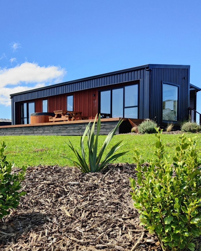 Photo of property: Plenty of room to relax on the 40sqm deck, with a hot tub and Weber BBQ available for use.